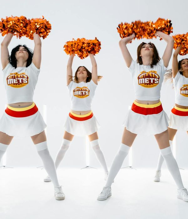 Woman performing a fluid movement exercise with cyan energy lines.